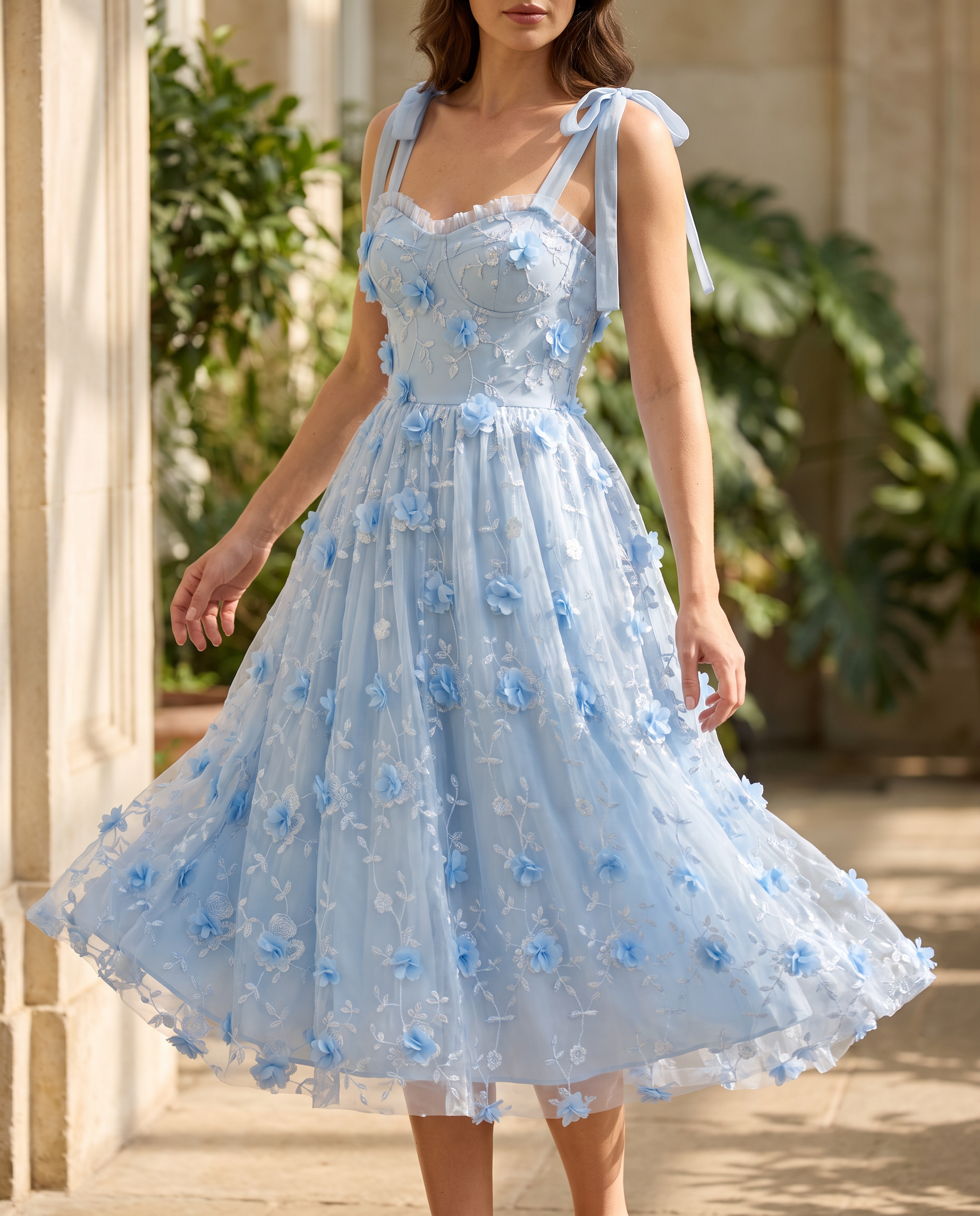 The BIA Celeste Appliqué Midi in movement, the appliquéd tulle skirt turning in a bright conservatory.