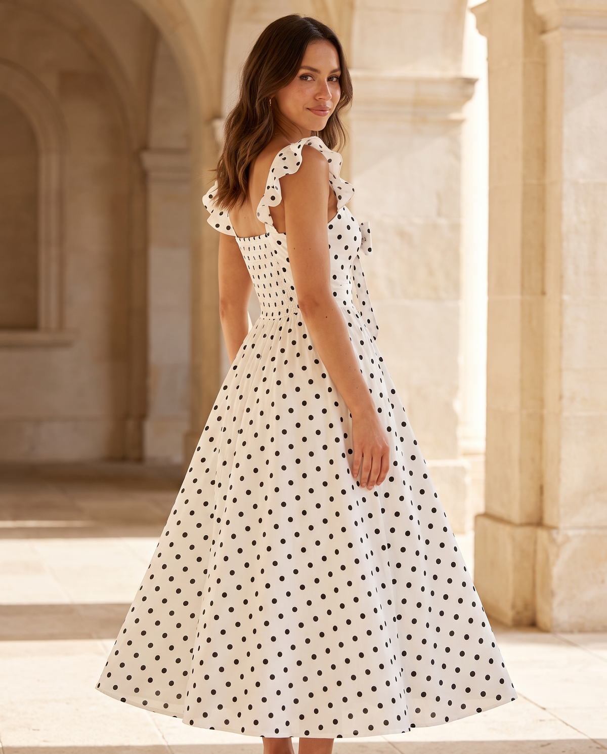 The BIA Elara Polka Maxi from a three-quarter angle, showing the smocked back and full skirt.