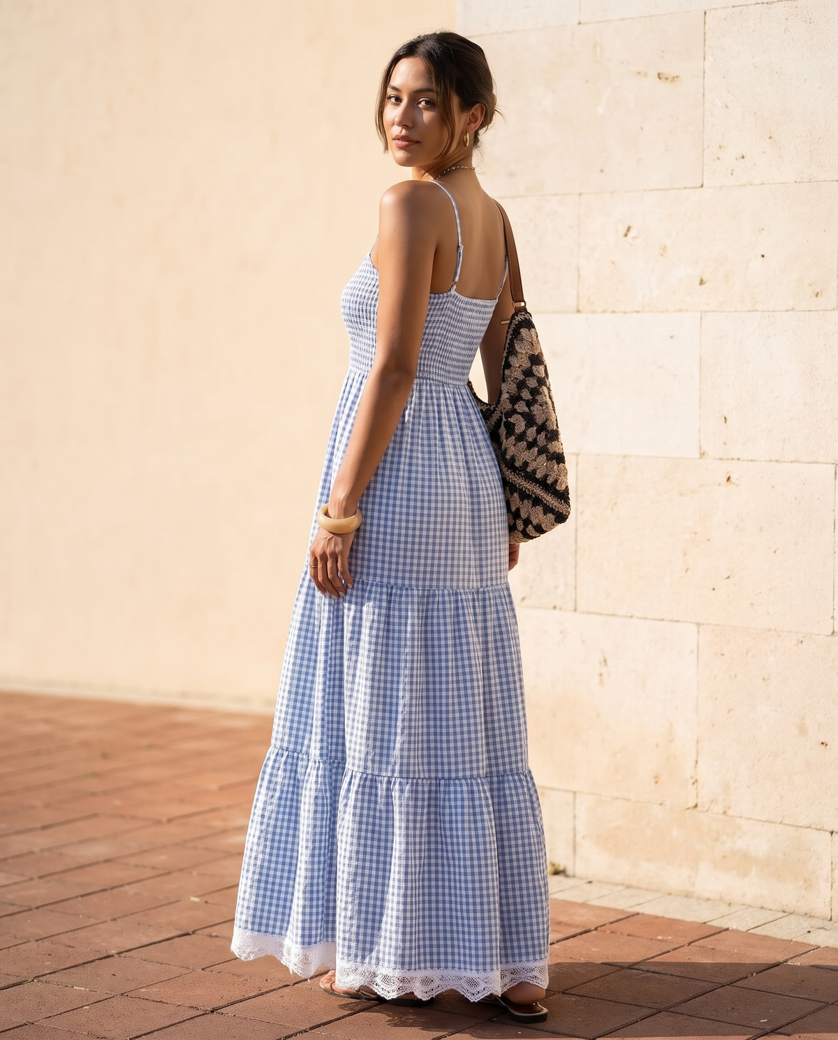 The BIA Amélie Check Dress from a three-quarter angle, showing the smocked back and tiered skirt.