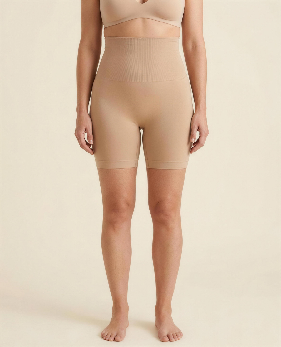 BIA warm beige seamless high-waist shaping short, front studio view showing the wide ribbed waistband and mid-thigh leg.