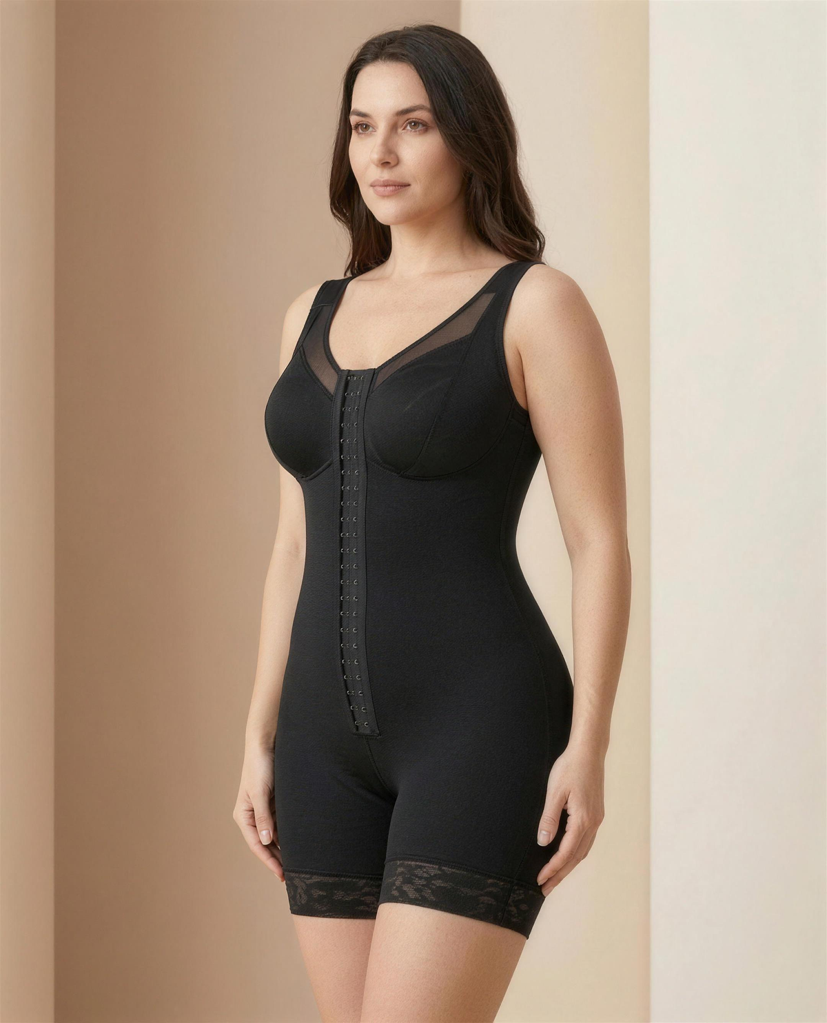 The Meridian Full-Body Shaping Layer in black, three-quarter view showing the shoulder straps and lace-trimmed leg
