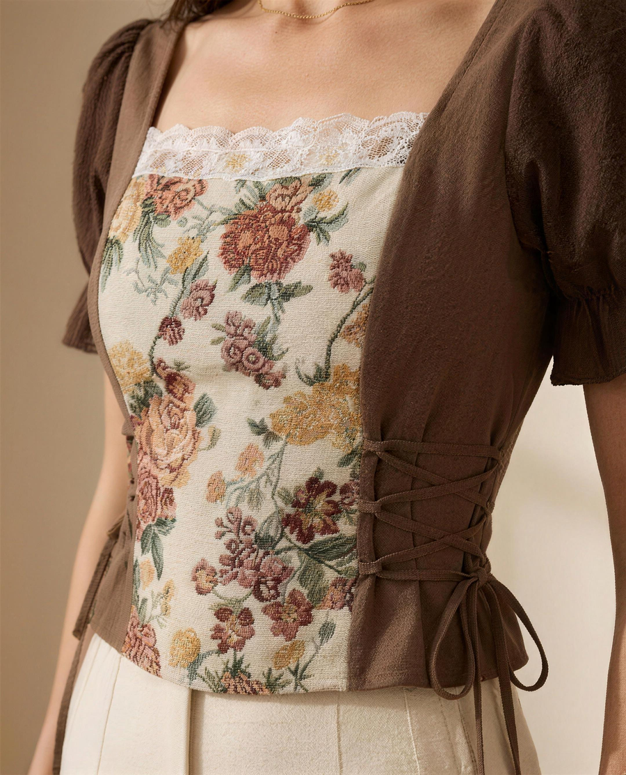 Close detail of the woven tapestry floral, the white lace neckline trim and the side lace-up tie