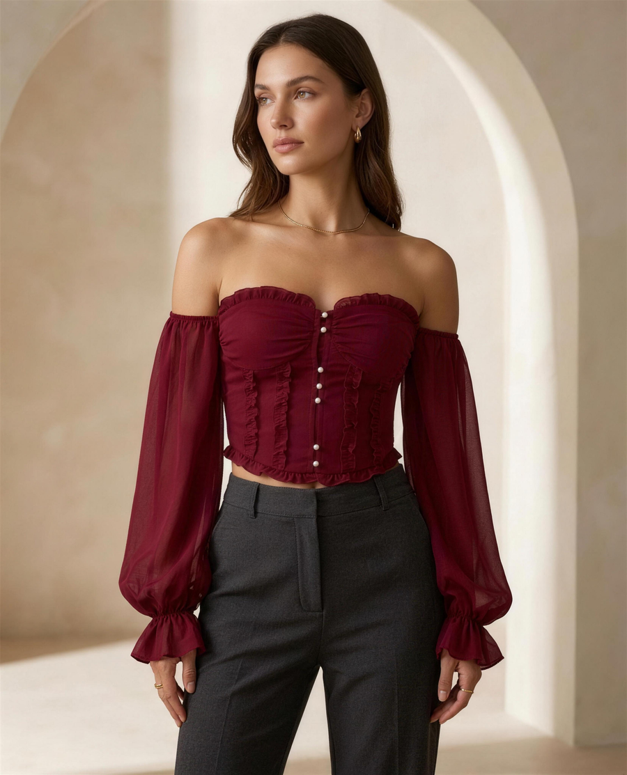 The Aveline Pearl-Button Blouse in burgundy, off-shoulder ruffle neckline with faux-pearl button placket and flare sleeves