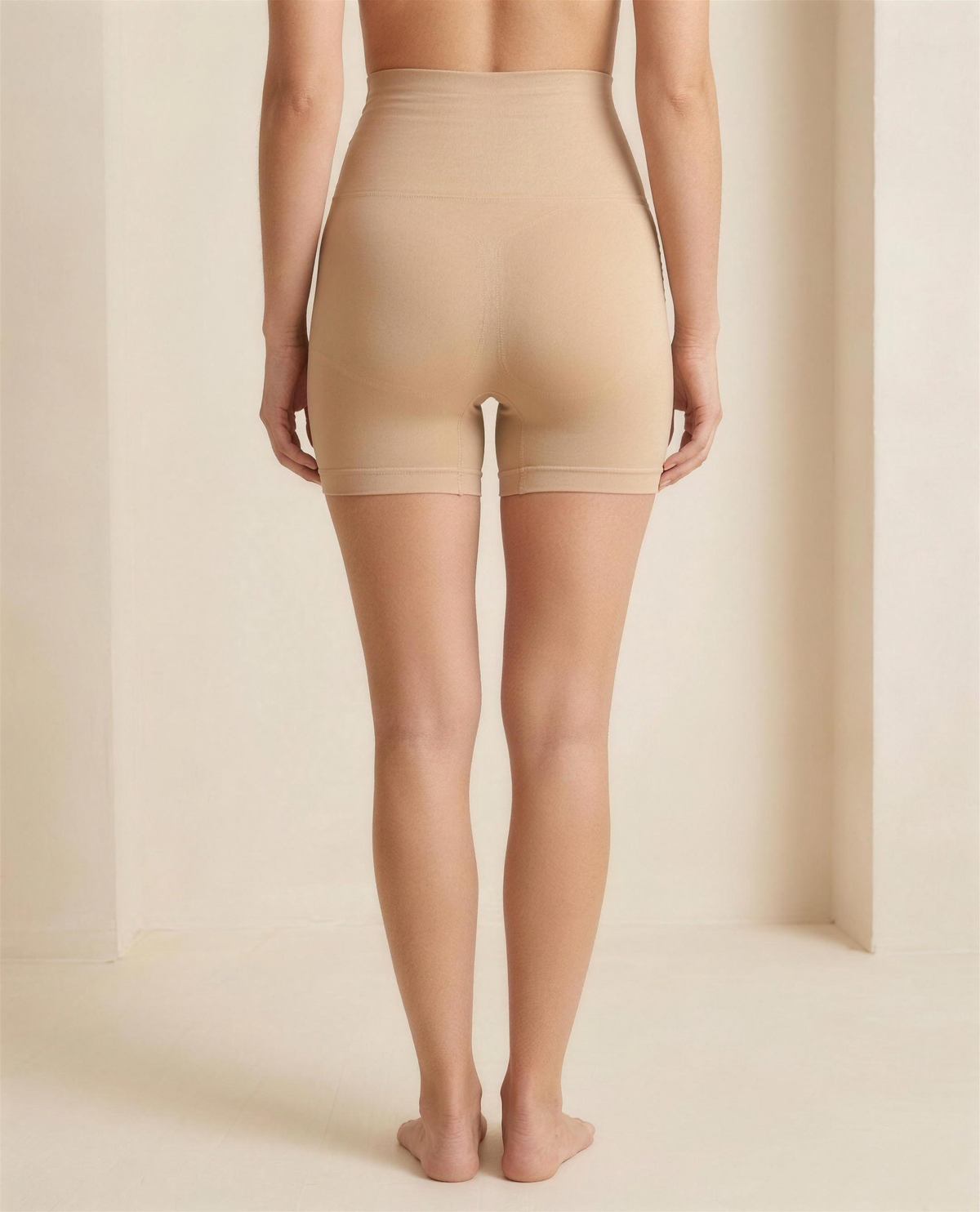 The Lune High-Waist Shaping Short in warm beige, rear view showing the contoured knitted seat panel