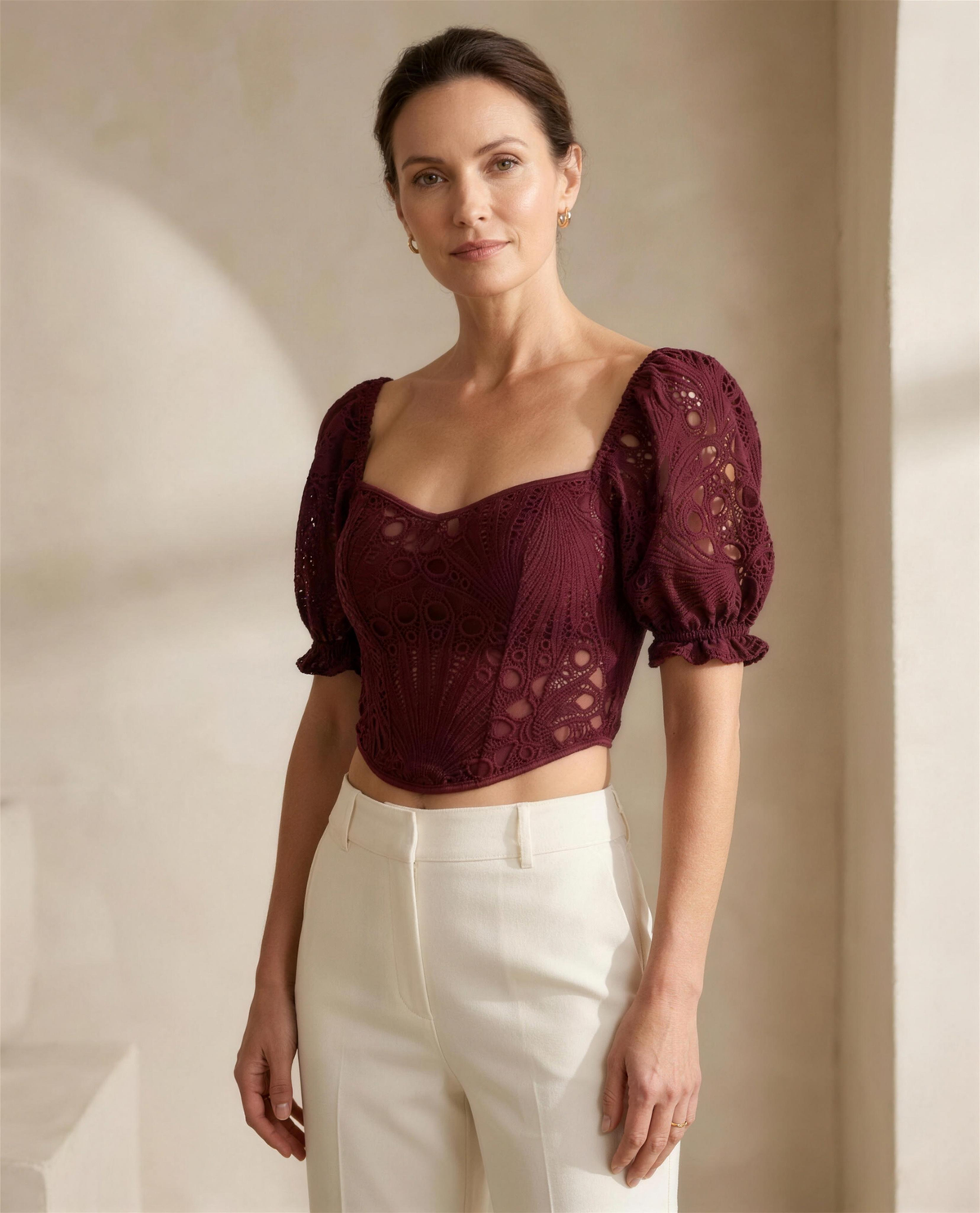 The Odile Openwork Top in burgundy, sweetheart neckline with short puff sleeves in openwork knit