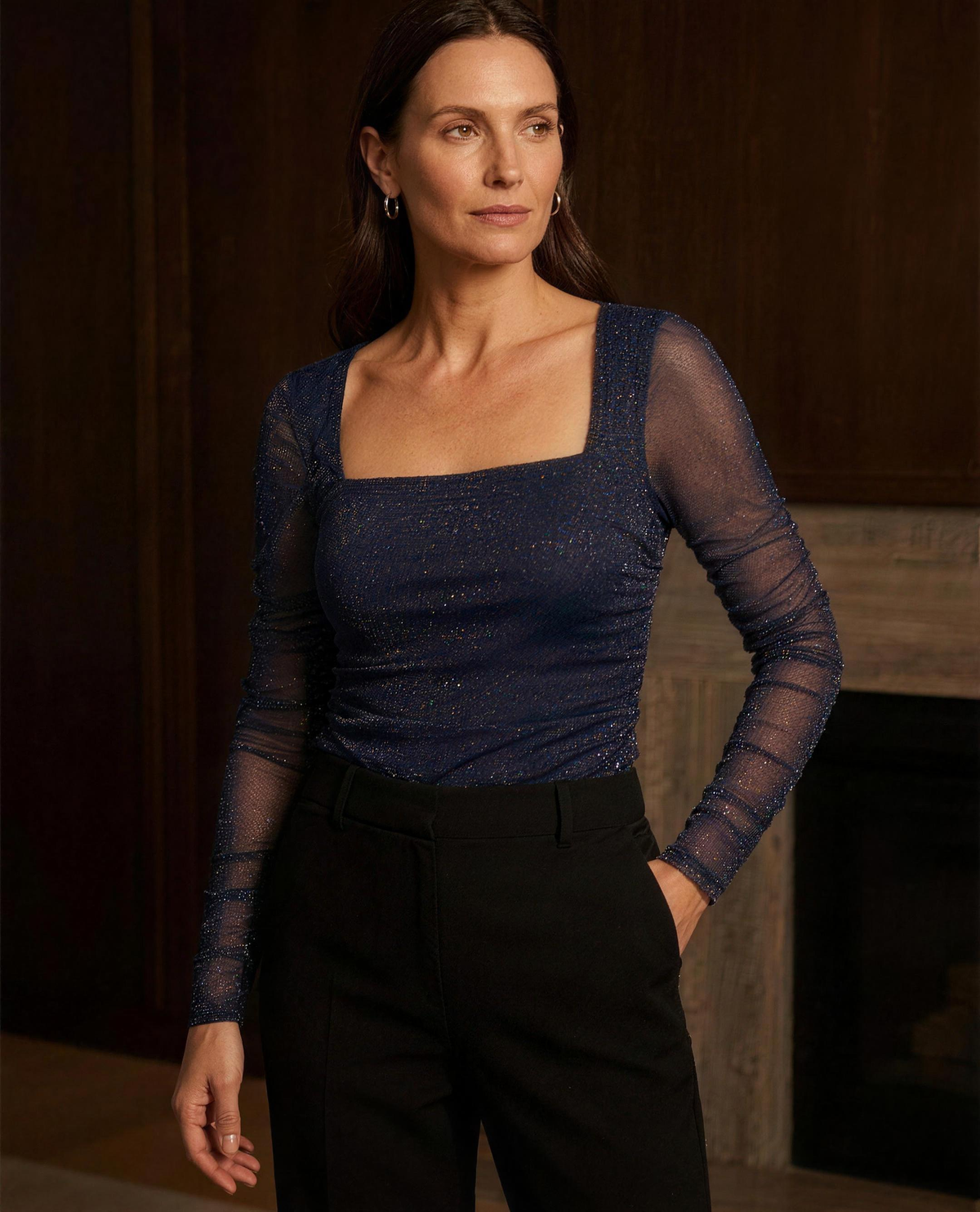 The Solene Glitter Mesh Top in navy, three-quarter view