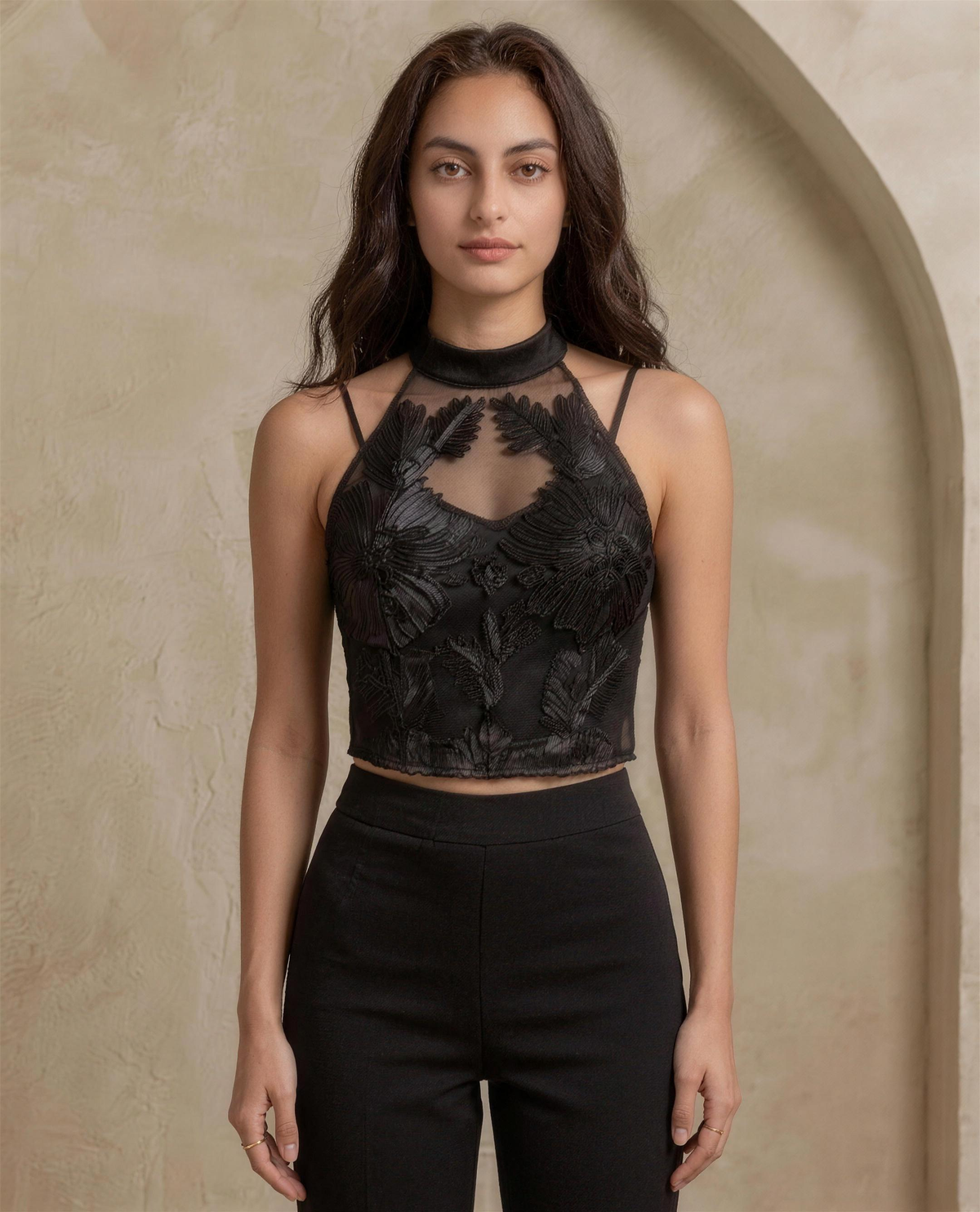 The Ilaria Applique Halter in black, full front view showing the banded halter neck and scalloped hem