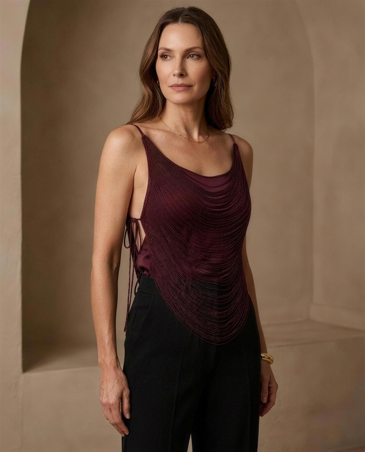 The Lyra Fringe Camisole in burgundy, three-quarter view